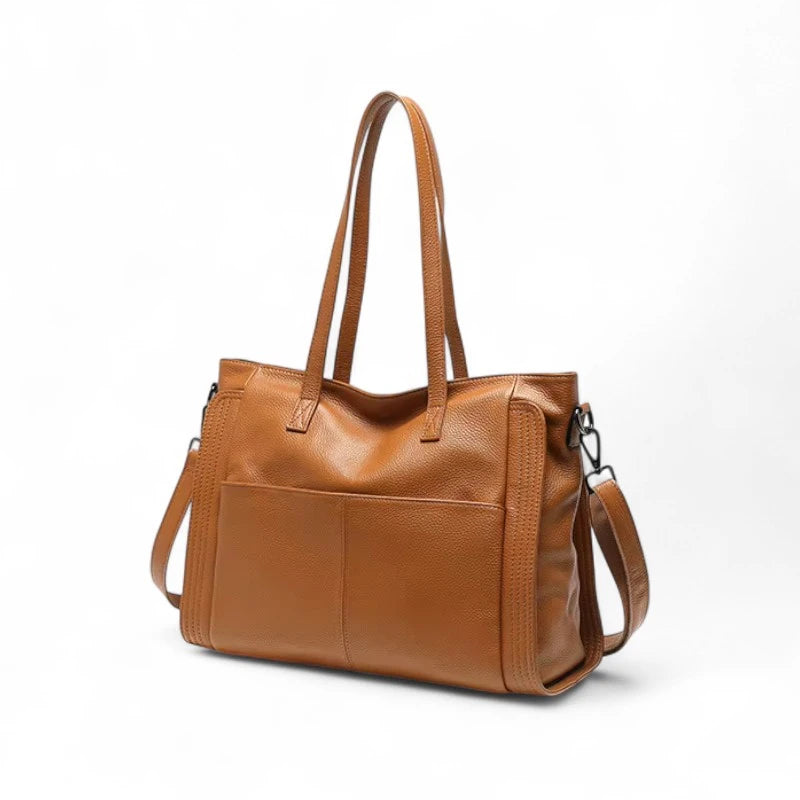 Bolsa de couro feminina Eliana marrom, vista lateral, com alça reforçada e design sofisticado.